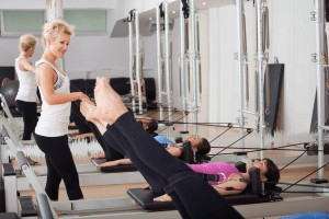 Women using Pilates Equipment — Physiotherapy in Noosa, QLD